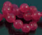 Jade Kugeln facettiert 10mm Fuchsia Schnur 40cm 38pcs